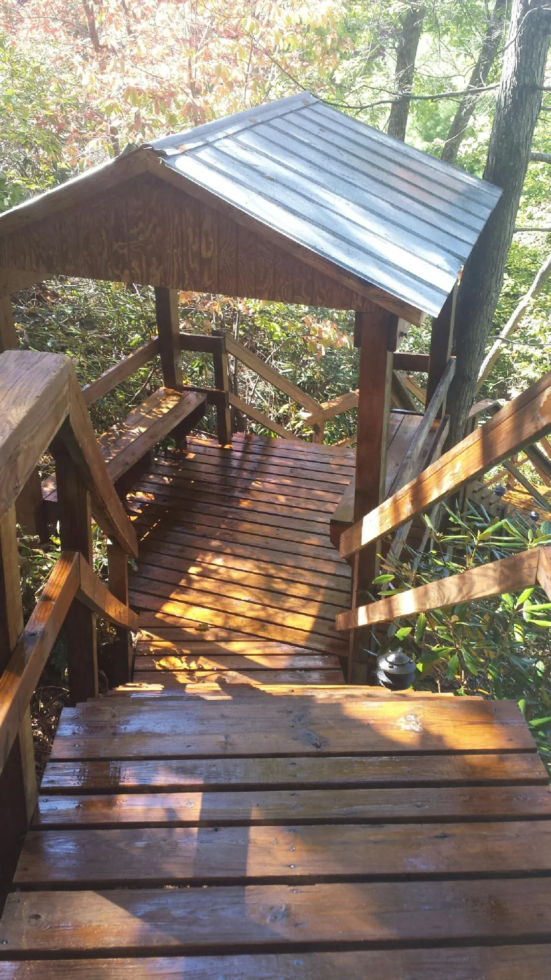 Freshly stained wood walkway and covered shelter with a metal roof in Flagler